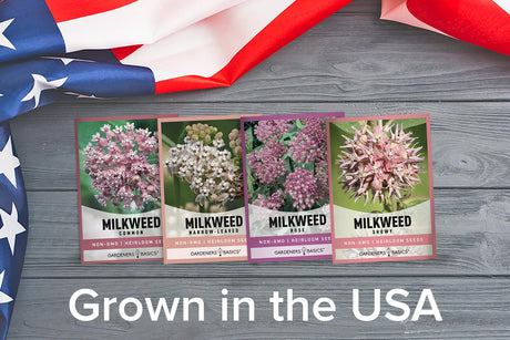 Four milkweed seed packets arranged on a gray wood surface with an American flag draped in the background. Large white text at the bottom reads 'Grown in the USA'.